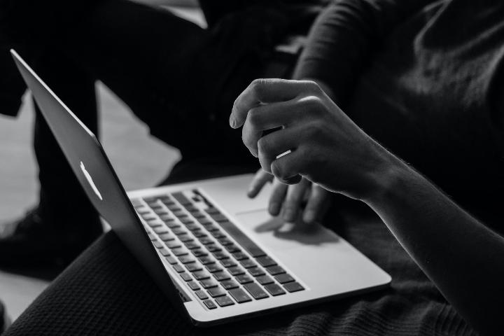 A person working with a laptop with high productivity and efficiency