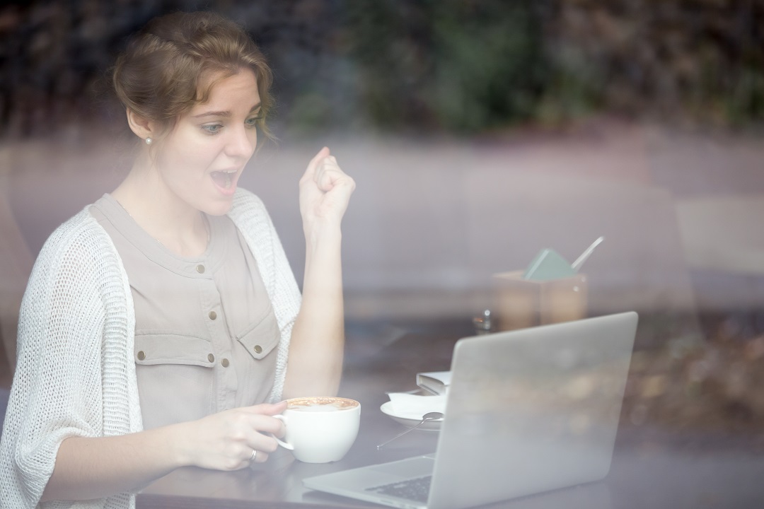 A business woman in joy achieving business integration